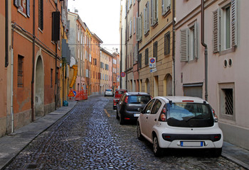 Fototapeta na wymiar the narrow street in italian city Modena