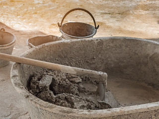 Mixing a cement in basin for applying construction