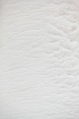 Winter fluted fluffy snow texture 