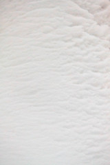 Winter fluted fluffy snow texture 