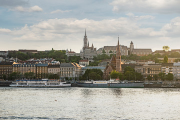 Obraz premium Budapest is the capital of Hungary.Beautiful big old town.The magnificent city is rich in history.The photo is made on a sunny day.City landscape with a wide large river.Beautiful buildings.Landscape.