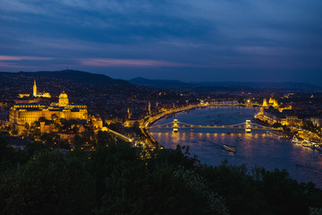 Fototapeta na wymiar Panorama of Budapest's evening.Capital of Hungary.Beautiful big old town.The photo is made in the dark.The magnificent city is rich in history.City landscape with a wide large river. Golden city.