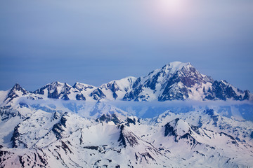 Clouds running over snowy peak of Mont Blanc range