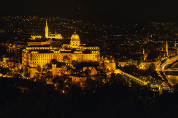 Fototapeta na wymiar Panorama night Budapes.Capital of Hungary.Beautiful big old town.The photo is made in the dark.The magnificent city is rich in history.City landscape with a wide large river.Beautiful golden city.