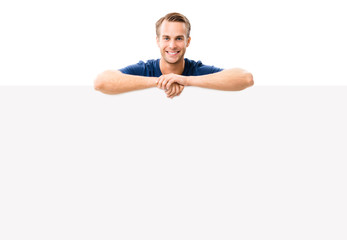 young man showing blank signboard