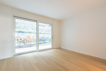 Fototapeta premium Empty room with parquet and window with garden view