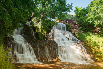 Fototapeta na wymiar High mountain waterfall