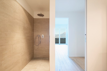 Modern marble bathroom with spotlights