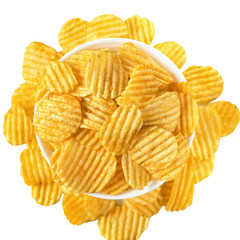 Bowl of tasty ridged potato chips on white background