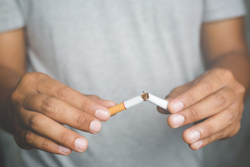 Man destroy Broken refusing cigarettes. concept for quitting smoking and healthy lifestyle.or No...