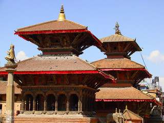Fototapeta premium Temples of Patan with red roofs. Ancient city in Kathmandu valley. Picturesque asian cityscape. Nepal.