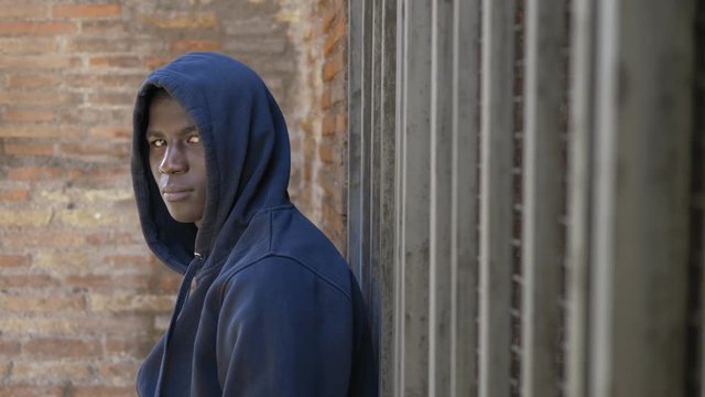 Confident Hoody American African Guy Turning And Staring At Camera In The City