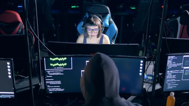 Two hackers cracking computers, close up. Cyber crime concept.