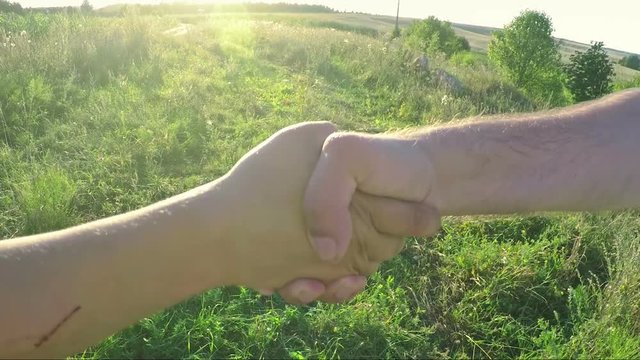 Closeup of Handshake with nature background