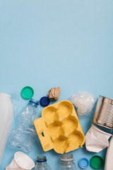 Top view of rubbish for recycling on a blue background