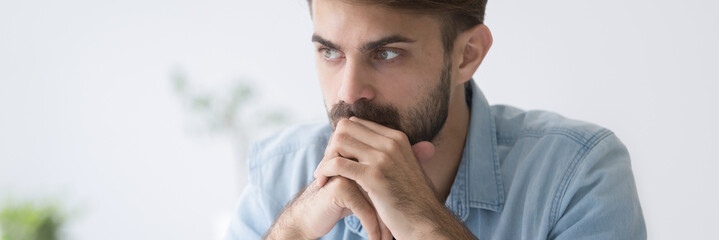 Horizontal photo close up face serious thoughtful pensive businessman student employee feels puzzled think about problem make decision concept banner for website header design with copy space for text - obrazy, fototapety, plakaty