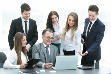 Fototapeta premium Director and business team looking at laptop screen.
