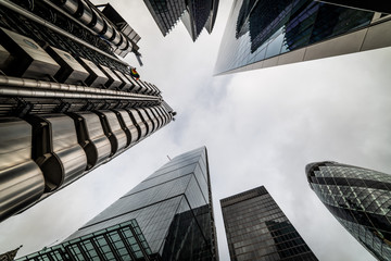 Low angle view of skyscrapers. Looking up perspective. Bottom view of modern skyscrapers in...