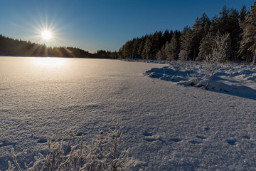 sunrise over a frozen lake in varmland