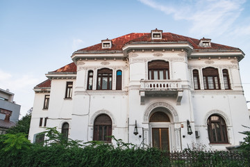 Obraz premium Ancient building on the Strada Putul de Piatra. Historical center of Bucharest with its beautiful architecture at sunset, Romania.