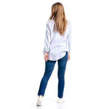 Woman in jeans and blue shirt goes on white background isolation, top view