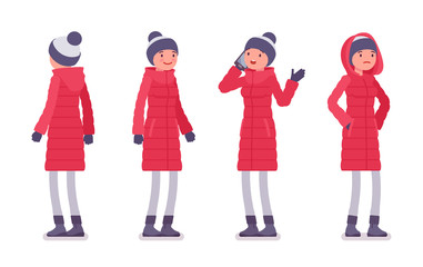 Obraz premium Stylish woman in a long red down jacket standing