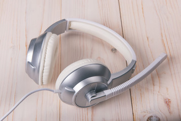 White stylish headphones on a light background