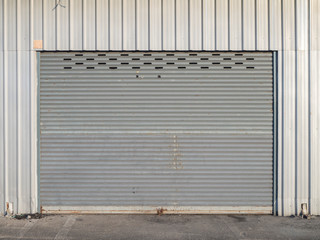 Obraz na płótnie Canvas front view of grunge close shutter door or rolling door