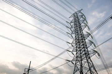 Electricity pole against blue sky clouds in dawn time, Transmission line of electricity to rural,...
