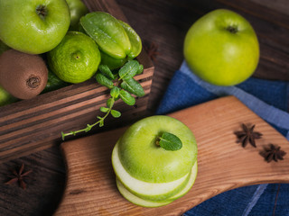 Set of green fruits for healthy diet and detox: apple, lime, kiwi, mango, carambola and mint.