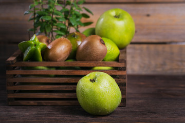 Set of green fruits for healthy diet and detox: apple, lime, kiwi, mango, carambola and mint.
