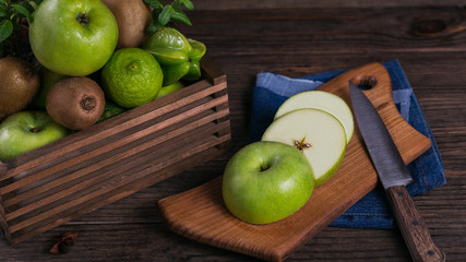 Set of green fruits for healthy diet and detox: apple, lime, kiwi, mango, carambola and mint.