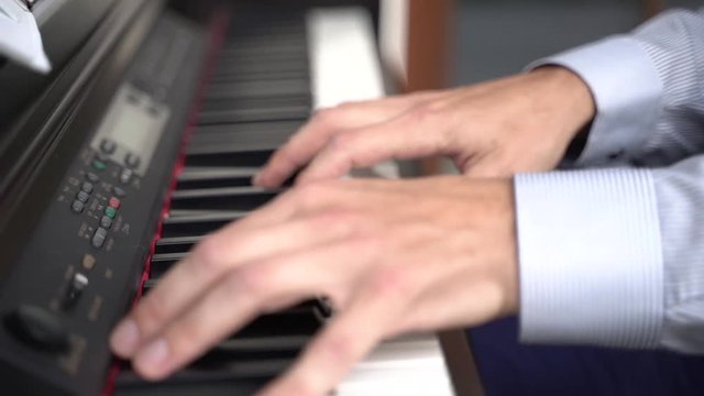 Piano music pianist hands playing.