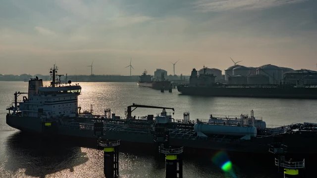 Timelapse of oil terminals , shipping and windmills in Port of Rotterdam