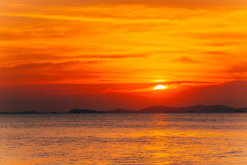 Fototapeta na wymiar Beautiful blazing sunset landscape and orange sky above it,summer background.