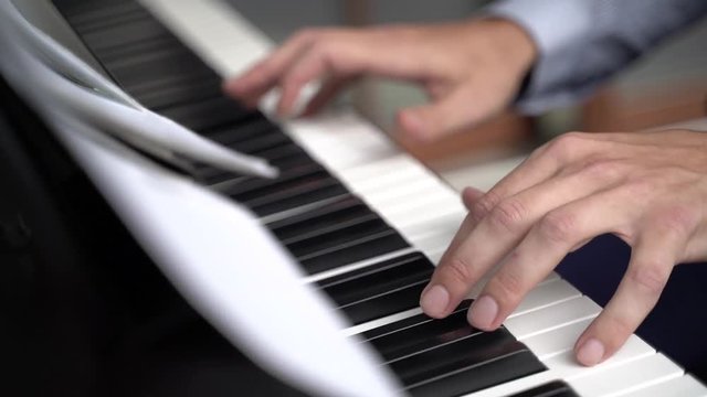 Piano music pianist hands playing.