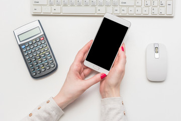 Woman uses a smartphone, copy space, top view, advertising, slogan