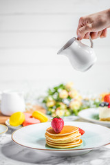 pancakes poured over syrup