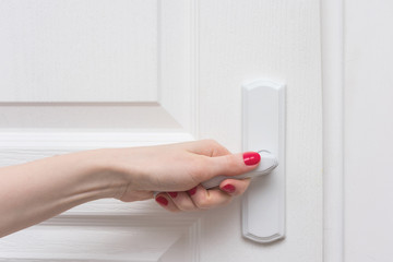 female hand, open door, front view, background, copy space, for advertising, slogan, close up