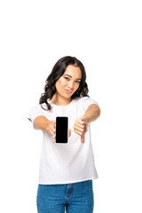 Fototapeta premium Dissatisfied asian woman holding smartphone with blank screen and showing thumb down isolated on white