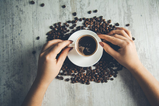 woman hand coffee with  beans