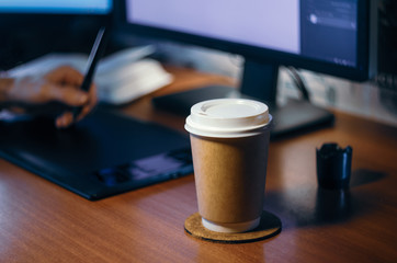 Desktop side view. Computer Graphics Tablet Diary Cup of coffee Hand. Concept for website banner,...