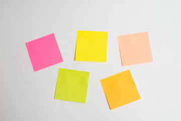 Message on paper with word Internet of Things on note stick on colorful book with laptop and a cup of coffee on glass table, top view image - Image, Many colorful note sticks