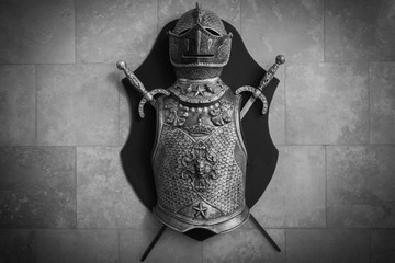 Old knight armour with helmet and crossed swords