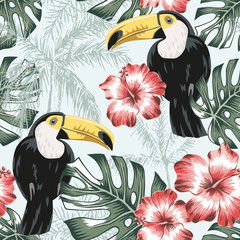Toucans, monstera leaves, pink hibiscus flowers, palm trees background. Vector floral seamless pattern. Tropical illustration. Exotic plants, birds. Summer beach design. Paradise nature