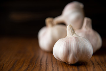 Garlic bulb on the wooden vintage background