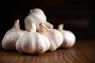 Garlic bulb on the wooden vintage background
