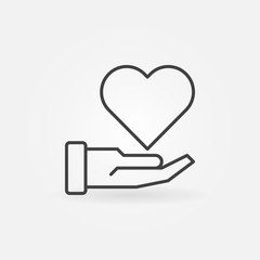 Hand with heart vector charity concept icon or sign in thin line style