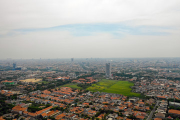 Aerial cityscape modern city Surabaya with skyscrapers, buildings and houses. city skyline with skyscrapers and business centers Surabaya capital city east java, indonesia