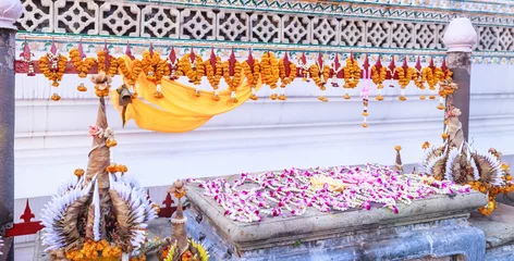 Fototapeten Baai Sri Trays and Flower Garlands offering in Thai Buddhism Brahman ceremony to console people’s life spirit to return to body, and be expression of congratulation, joy, and appeasement for owner © Victorflowerfly